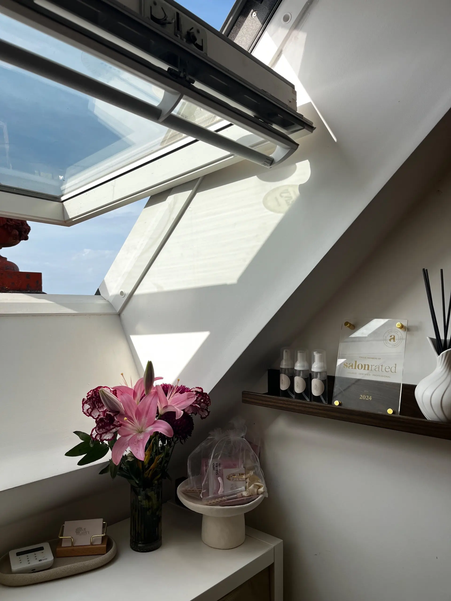 Skylight, lilies and products in the salon