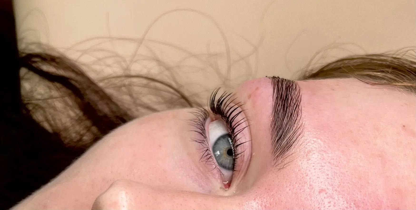 Lash and brow set on a client lying back